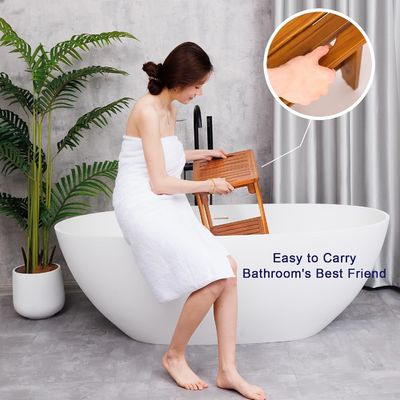 Staglio da bagno in legno di teak di colore naturale con manico e scaffale